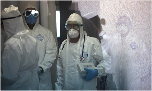 Workers at the Naval Hospital in Mexico City wore protective gear Friday in the area where people with possible flu symptoms were checking in. The New York Times.